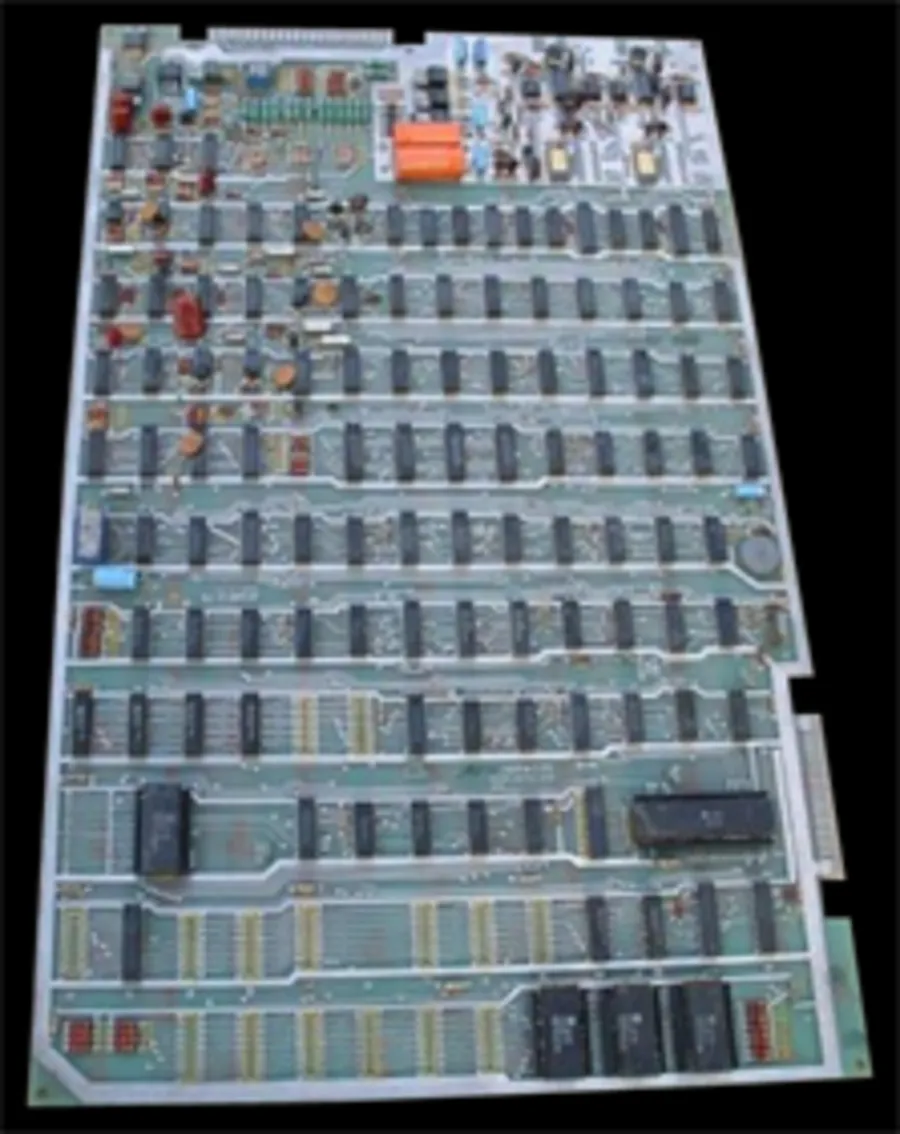 Asteroids arcade printed circuit board with rows of chips and edge connector visible.