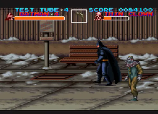 Batman faces a Thin Clown enemy outside a wooden train station in deep snow, with park benches and a lamppost between them; the HUD shows TEST TUBE x4, BATMAN x4, and the enemy's portrait labelled THIN CLOWN.