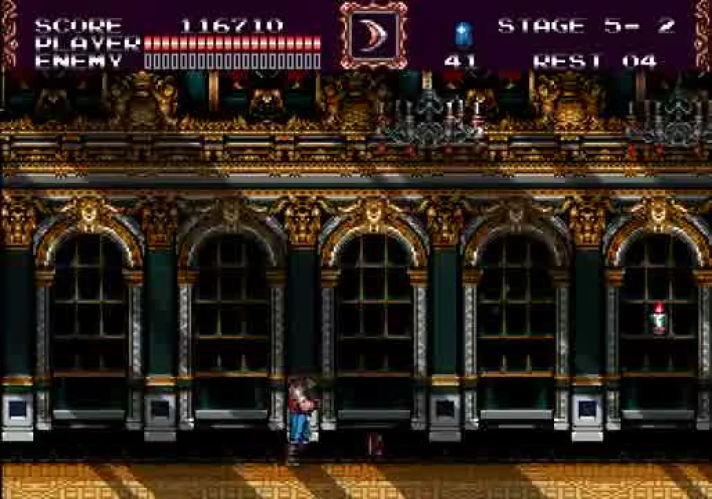 The interior of a gilded baroque hall, columns and arched windows running deep into a vanishing point, candelabras lit, the player visible mid-frame between two enormous pillars. Stage indicator reads '5 — 2.'