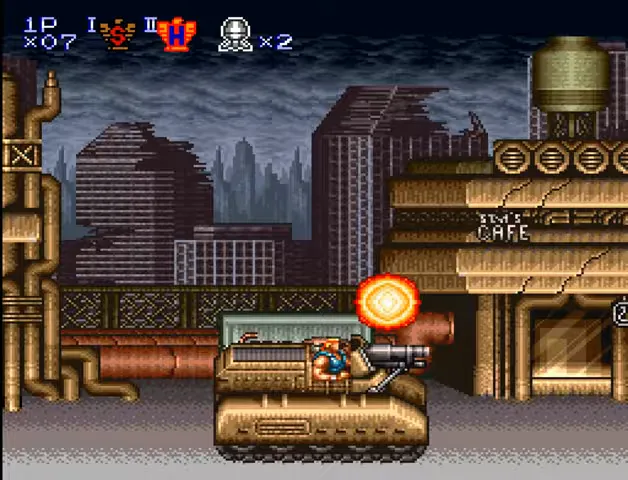 Bill stands atop a tank firing right, with explosions and ruined buildings in the background.