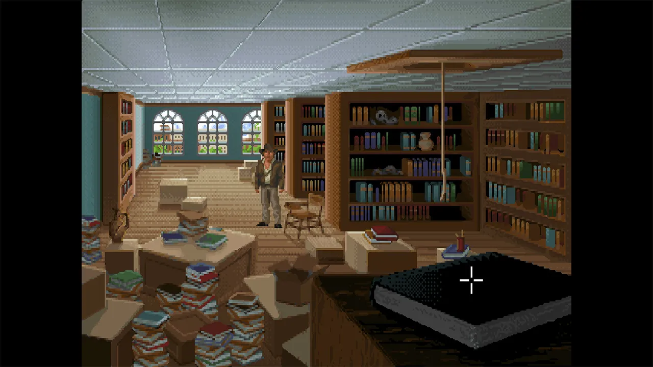 Indiana Jones in his Barnett College office, surrounded by ransacked bookshelves and overturned crates of books.