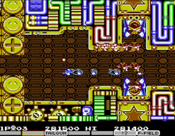 Parodius Da! stage ten — a yellow and gold metallic Gradius II-style corridor with mechanical pipework, recessed gears, and dot patterns; Vic Viper crossing the centre with bullets in mid-flight.
