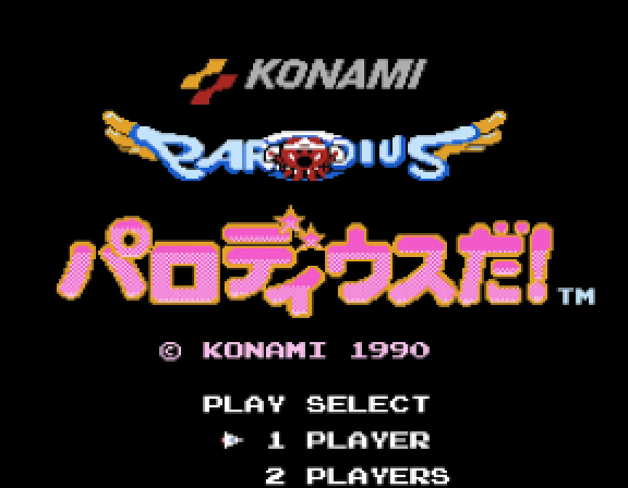 The Parodius Da! title screen — the Roman PARODIUS logo with winged Vic Viper above the pink katakana subtitle パロディウスだ!, © KONAMI 1990 below, and PLAY SELECT 1 PLAYER / 2 PLAYERS at the bottom.