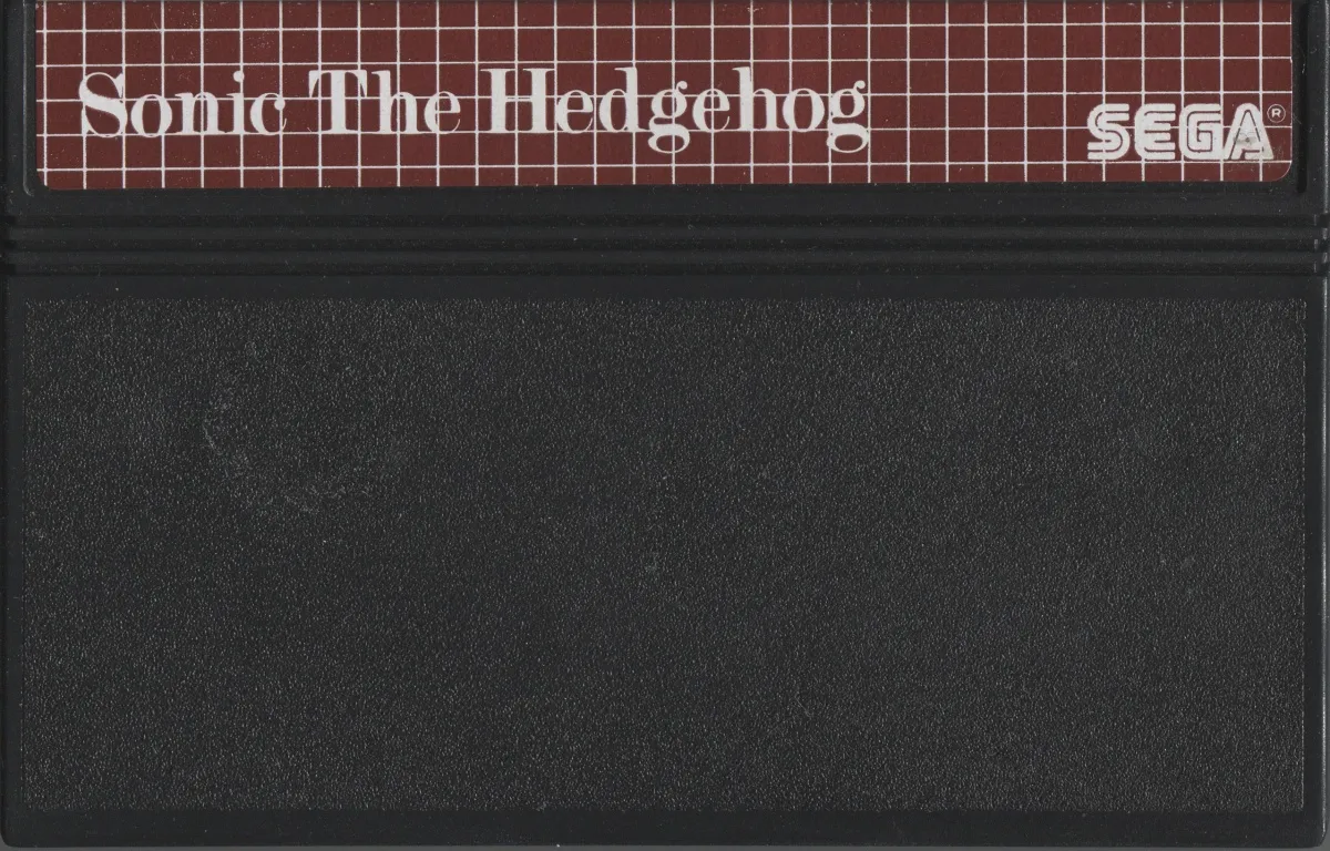 PAL Sega Master System cartridge for Sonic the Hedgehog, black plastic with the burgundy grid label and SEGA wordmark.