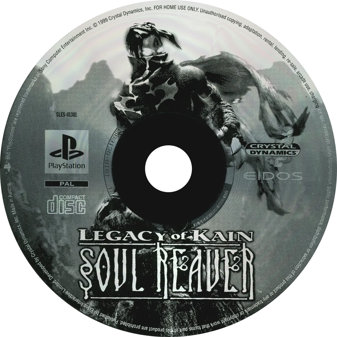 PAL PlayStation disc for Legacy of Kain: Soul Reaver, monochrome label dominated by Raziel rising from a mountainscape, PlayStation and Crystal Dynamics wordmarks ringing the spindle.